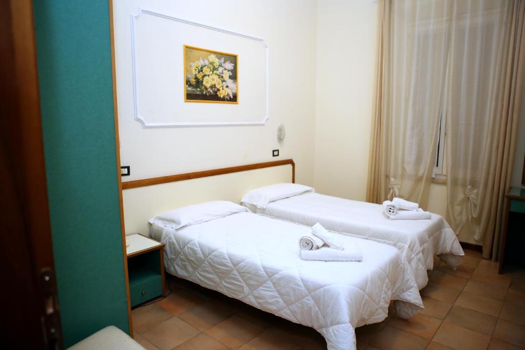 Postel nebo postele na pokoji v ubytování Hotel La Torre