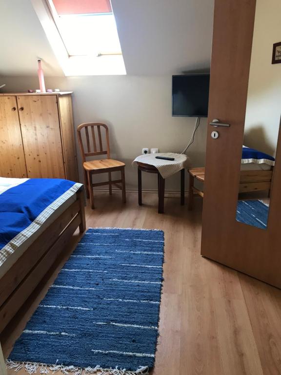 Łóżko lub łóżka w pokoju w obiekcie Prosper Lovasklub Panzió