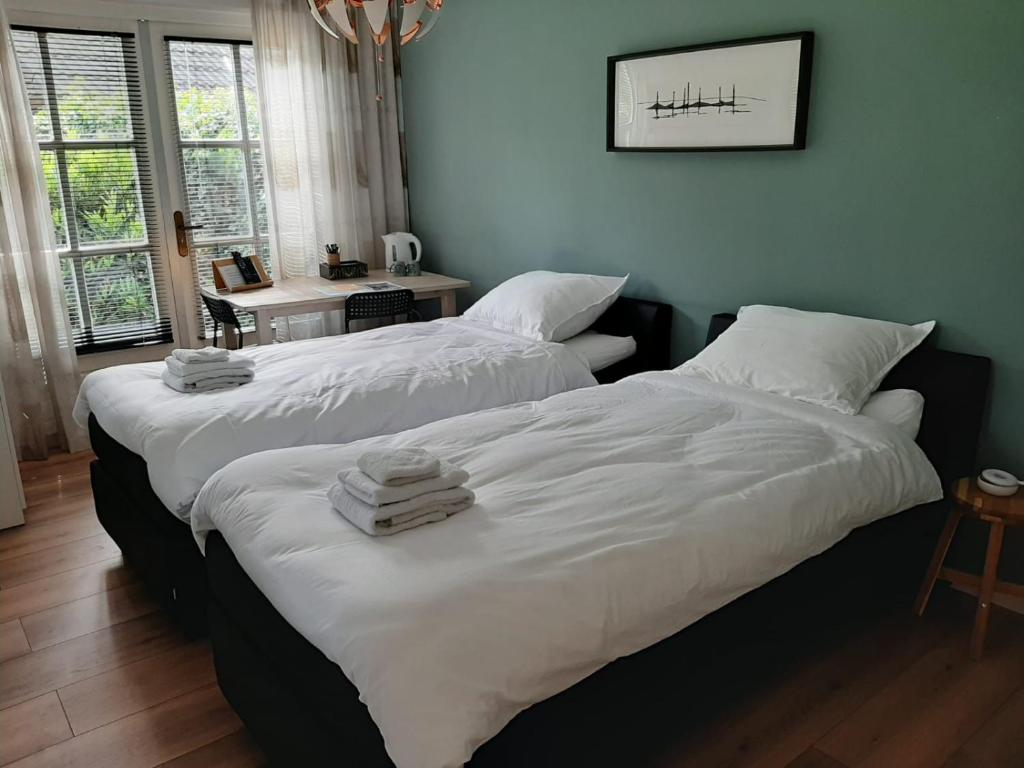 Postel nebo postele na pokoji v ubytování B&B De Reede