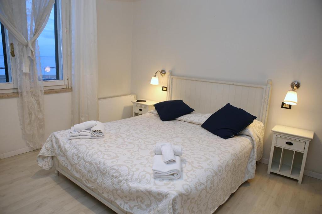 Postel nebo postele na pokoji v ubytování Hotel La Torre