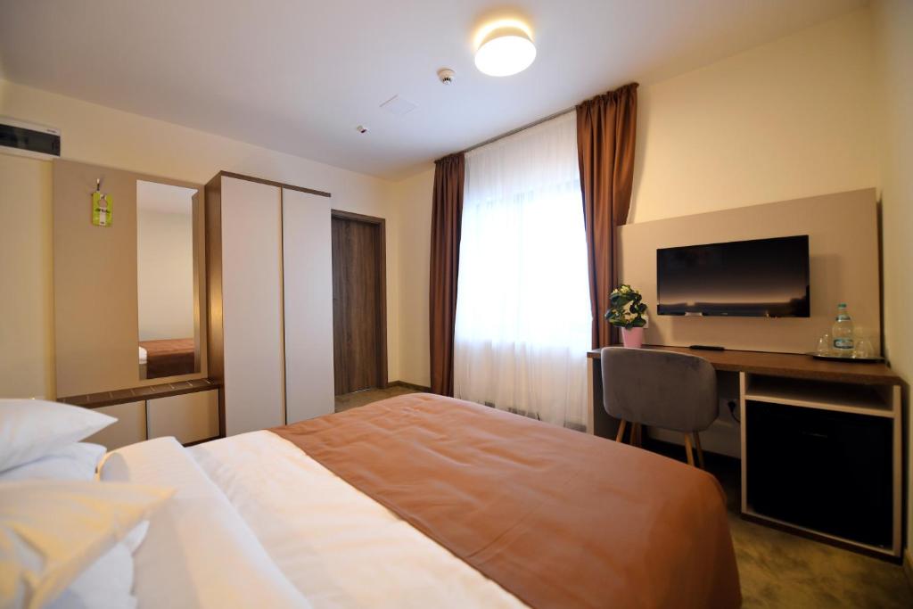 Postel nebo postele na pokoji v ubytování HoHa Boutique Hotel