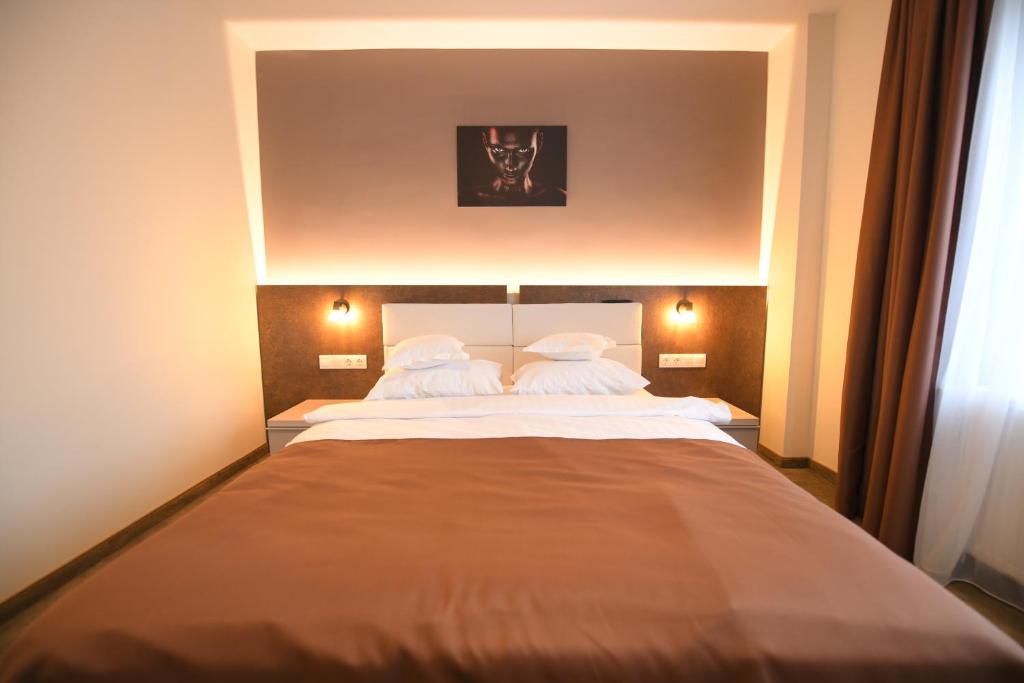 Postel nebo postele na pokoji v ubytování HoHa Boutique Hotel