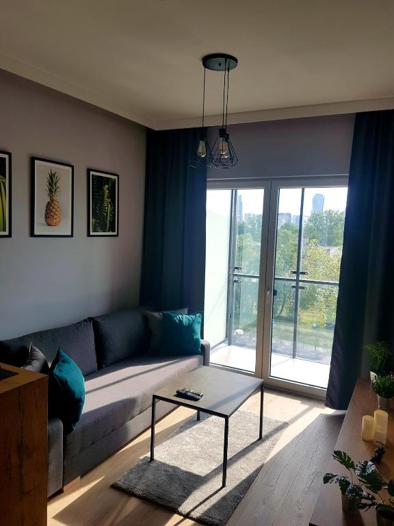 Posedenie v ubytovaní Wola Loft Apartment