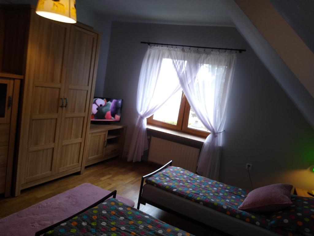Posteľ alebo postele v izbe v ubytovaní Apartament Marzeń Plaża Zalew i Las