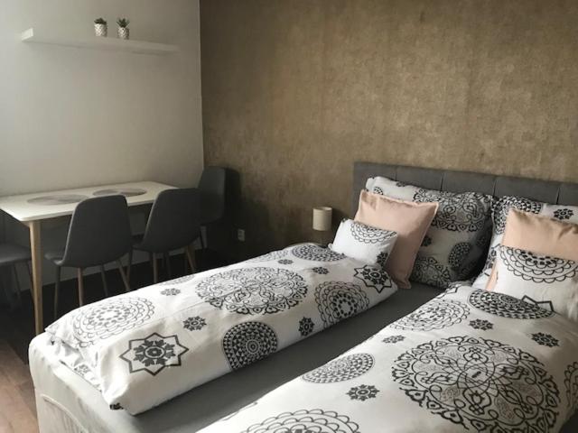 Postel nebo postele na pokoji v ubytování Apartmán Innova