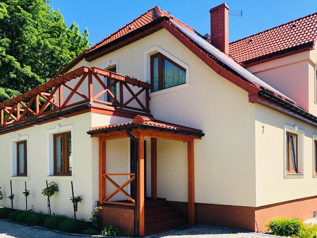 a house with a red roof at Na Radomskiej in Kołobrzeg