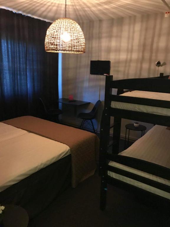 Postel nebo postele na pokoji v ubytování CarlstadCity H Boutique Hotell
