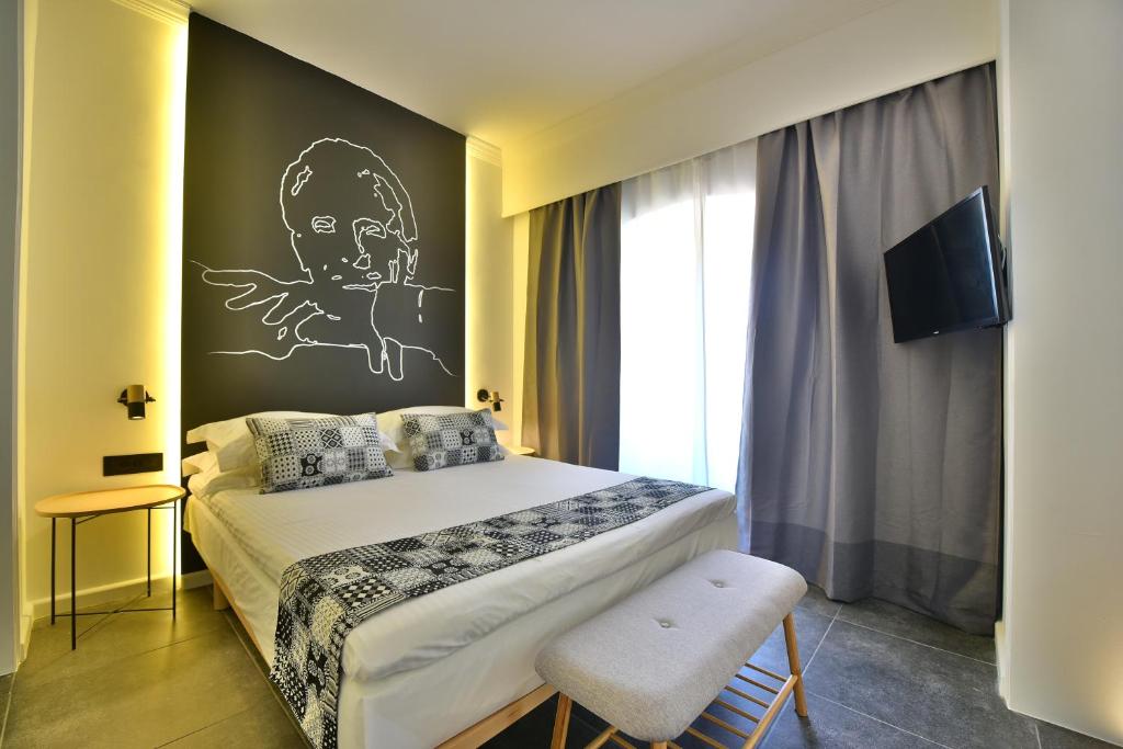 Postel nebo postele na pokoji v ubytování Hydra Icons