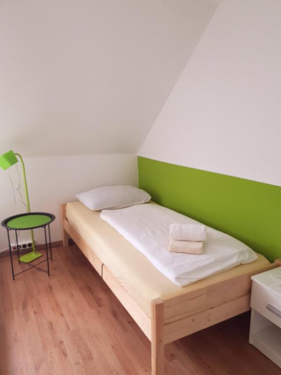 Postel nebo postele na pokoji v ubytování Guesthouse Osvald
