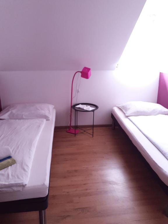 Postel nebo postele na pokoji v ubytování Guesthouse Osvald