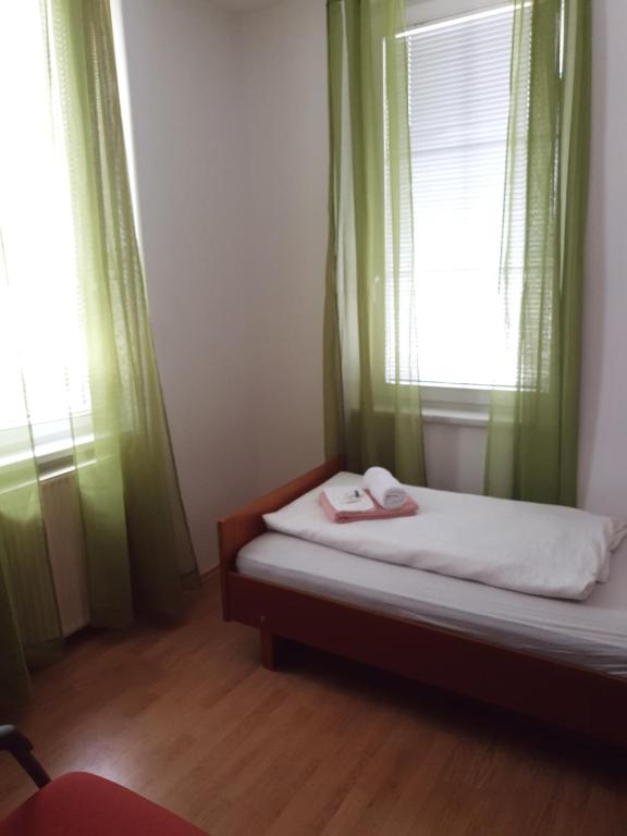 Postel nebo postele na pokoji v ubytování Guesthouse Osvald