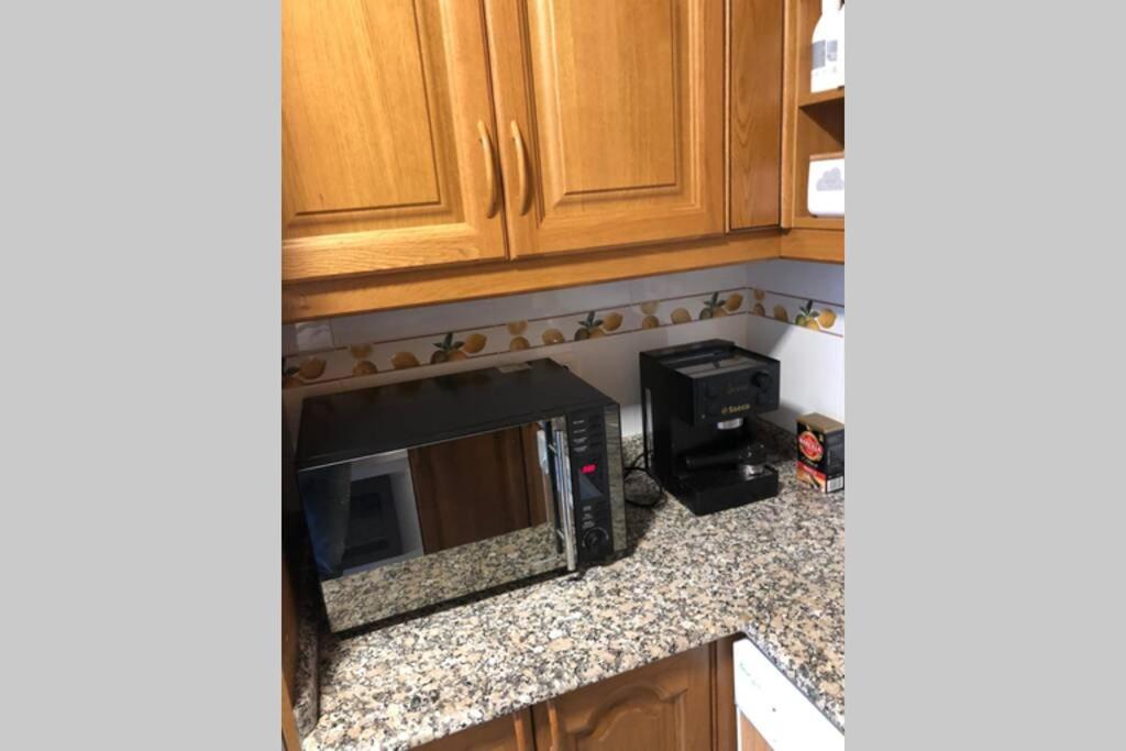 A kitchen or kitchenette at Ático tipo Loft centro de Mugardos