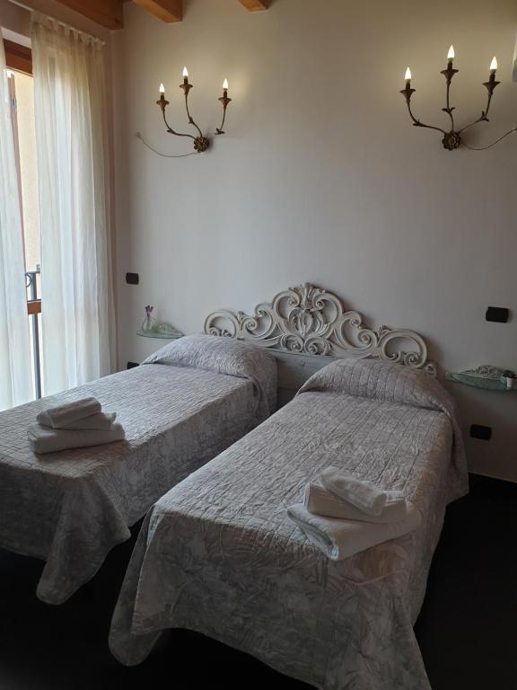 Postel nebo postele na pokoji v ubytování B&B Il Rustico