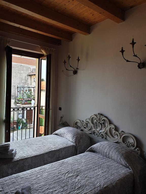 Postel nebo postele na pokoji v ubytování B&B Il Rustico