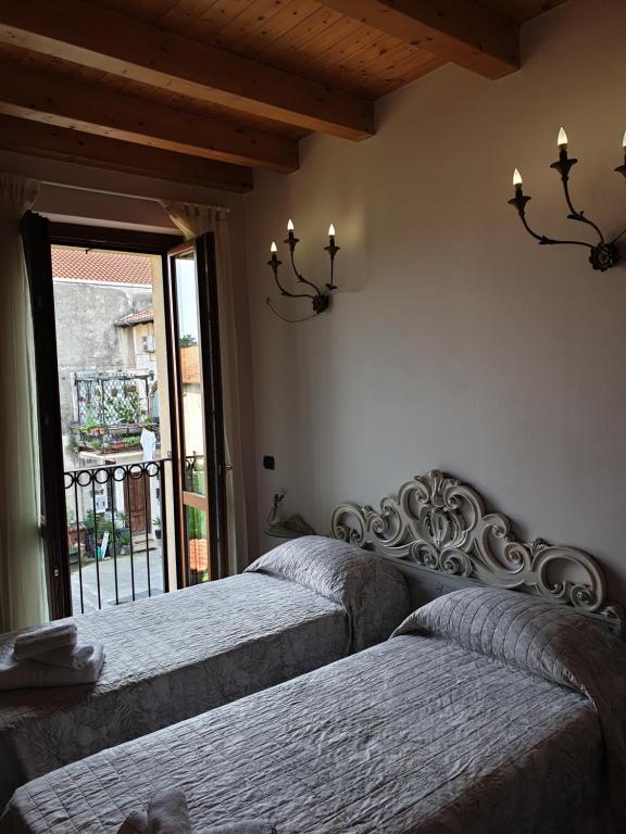 Postel nebo postele na pokoji v ubytování B&B Il Rustico