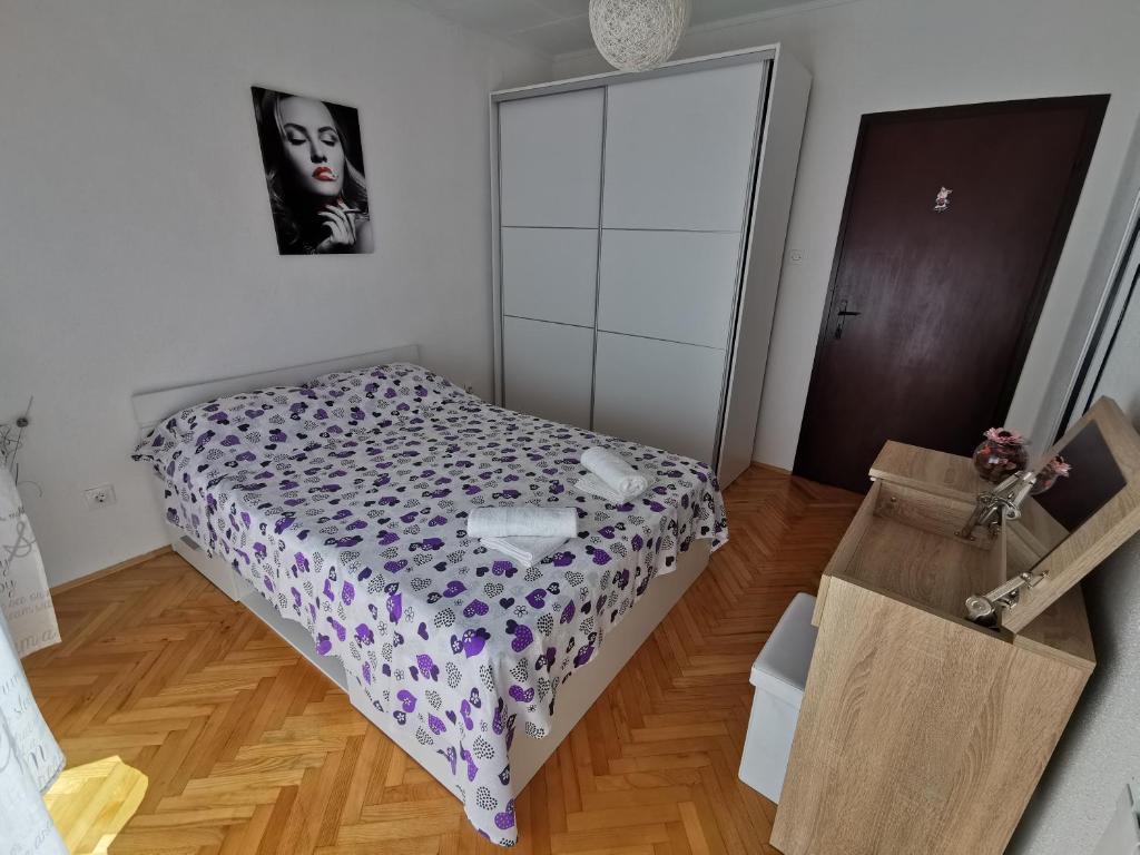 Postel nebo postele na pokoji v ubytování Apartment Piko