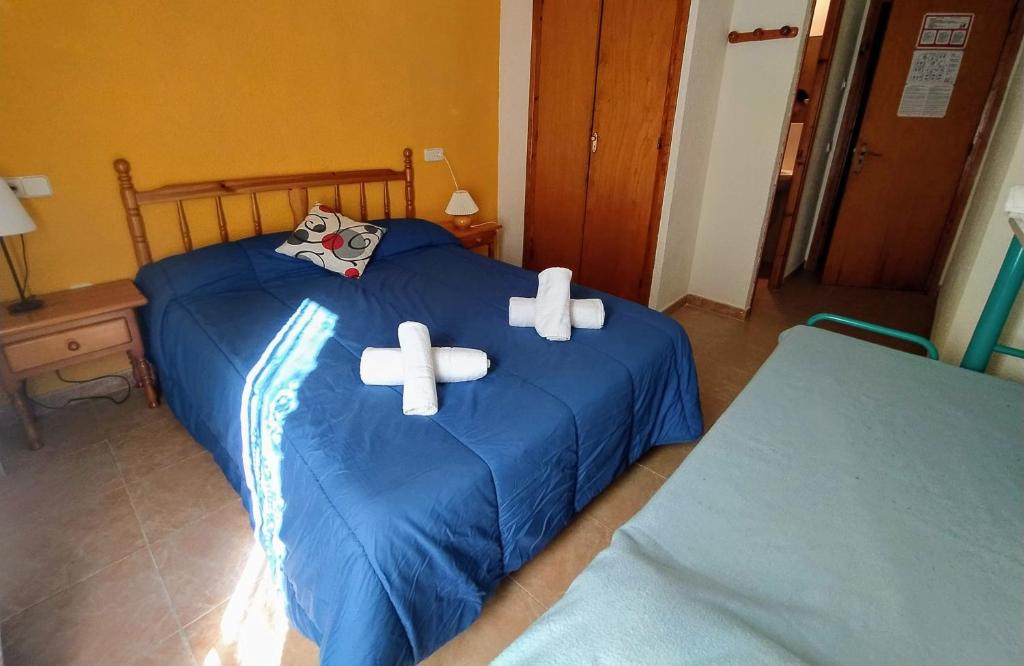 Postel nebo postele na pokoji v ubytování Hostal Pas De La Pera