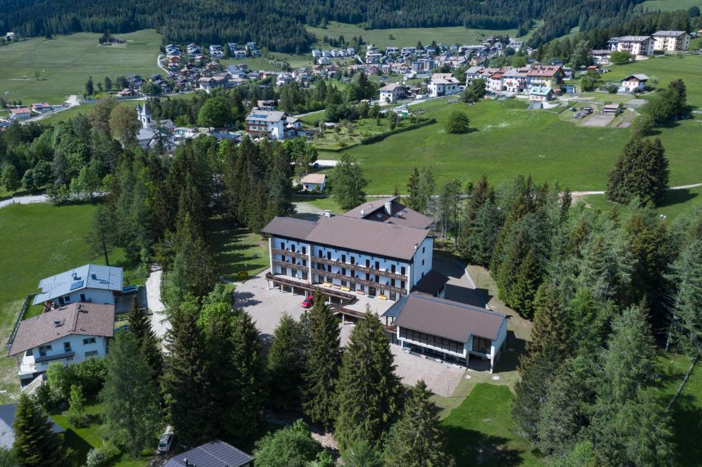 an aerial view of a large house in a village at Casa Santa Maria in Folgaria