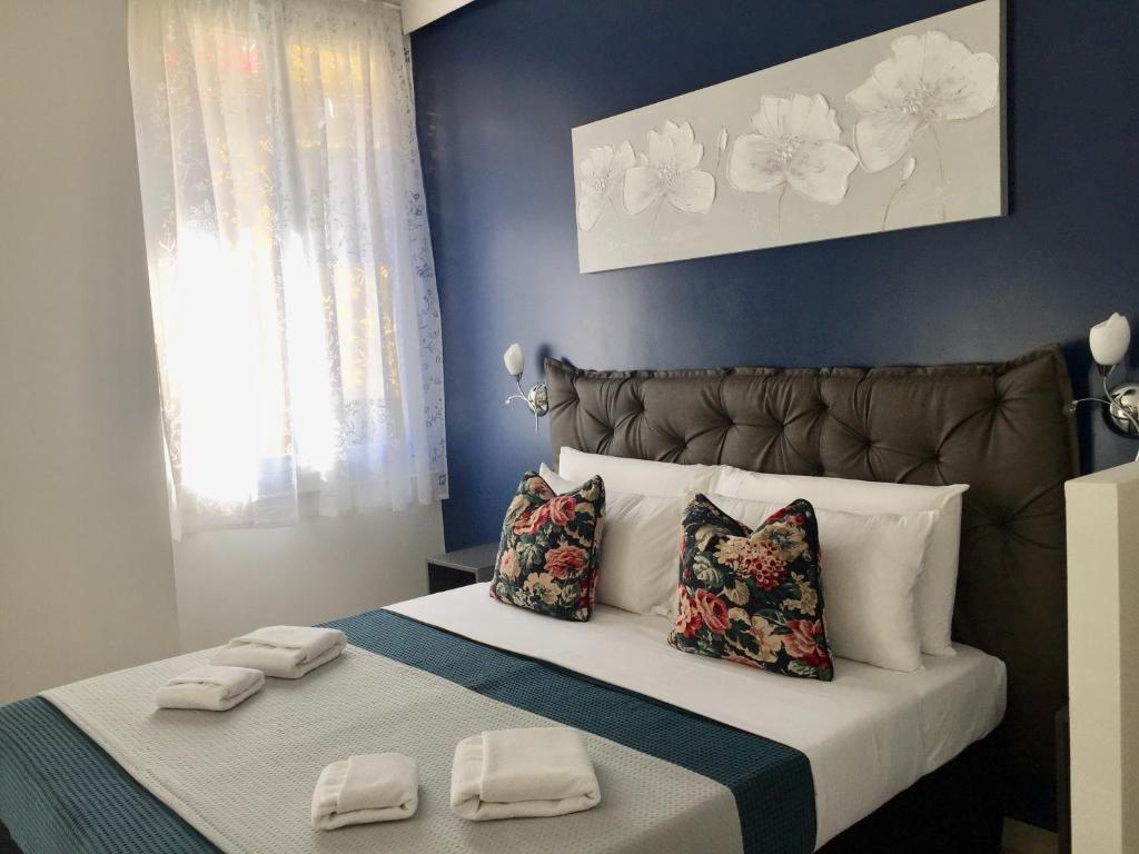 Postel nebo postele na pokoji v ubytování Sunset rooms