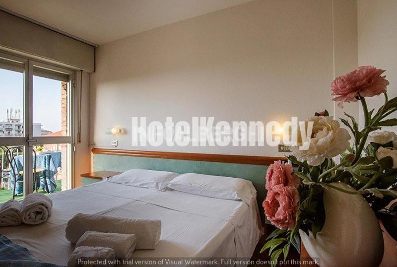 Postel nebo postele na pokoji v ubytování Hotel Kennedy