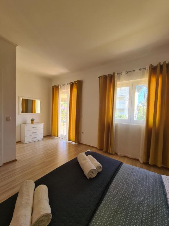 Posteľ alebo postele v izbe v ubytovaní Apartments Marijan