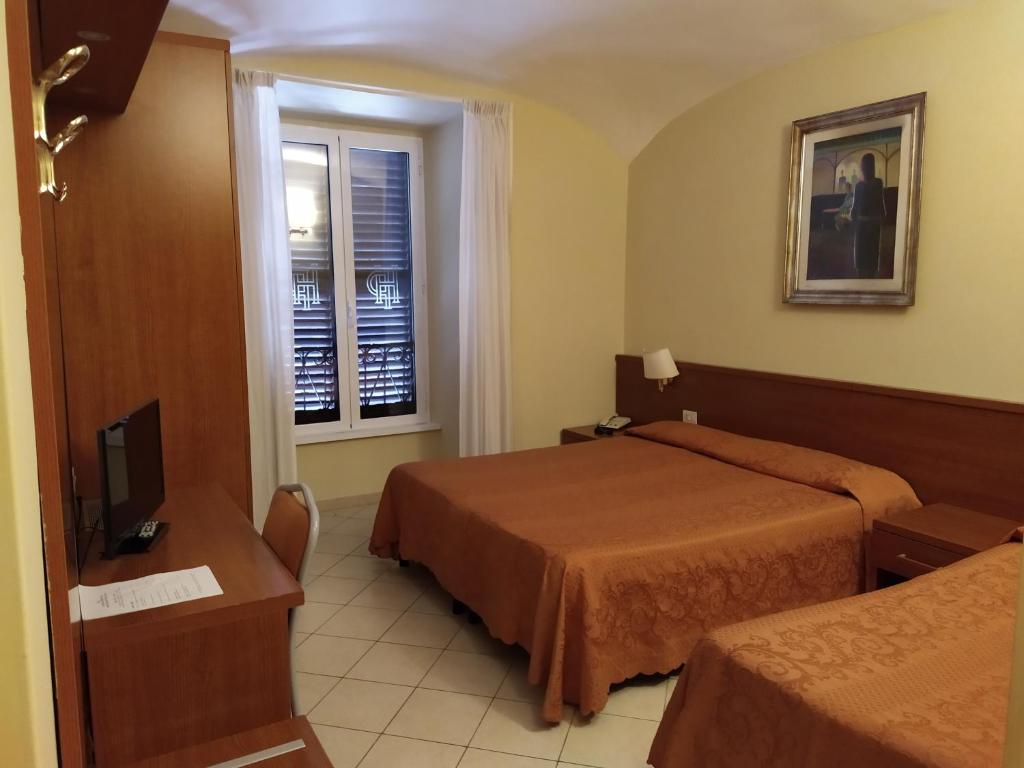 Postel nebo postele na pokoji v ubytování Hotel Priscilla