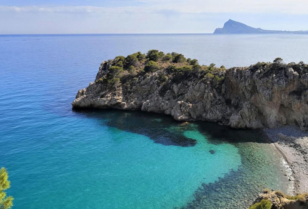 an island in the middle of the ocean at Altea Cala Mascarat in Altea