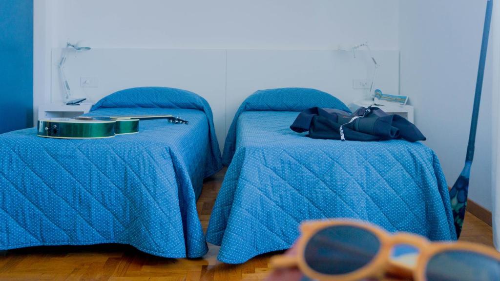 Posteľ alebo postele v izbe v ubytovaní Hotel Mistral