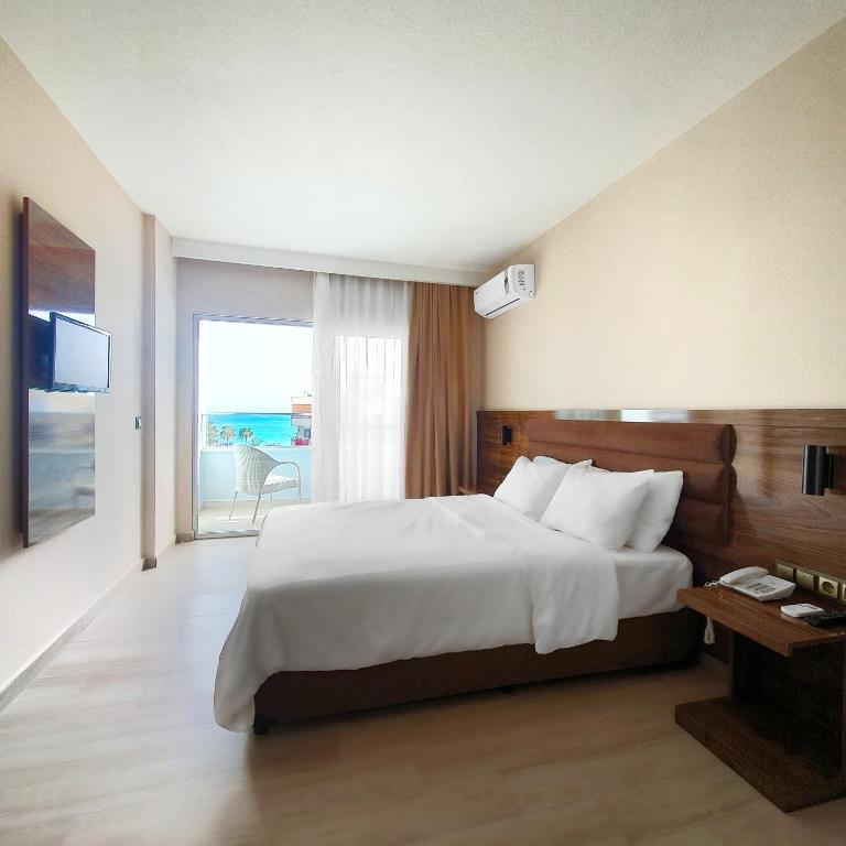 Postel nebo postele na pokoji v ubytování Ozgur Bey Spa Hotel