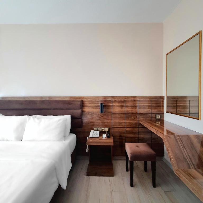 Postel nebo postele na pokoji v ubytování Ozgur Bey Spa Hotel