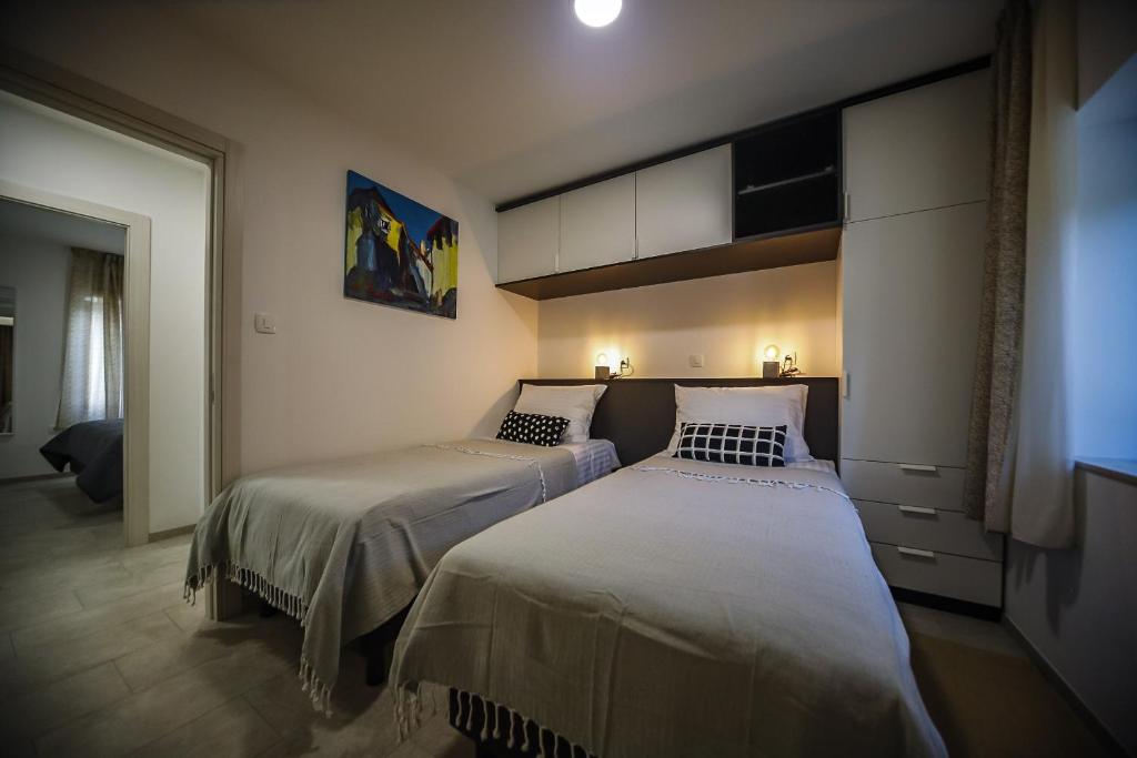 Łóżko lub łóżka w pokoju w obiekcie Casa Tilia
