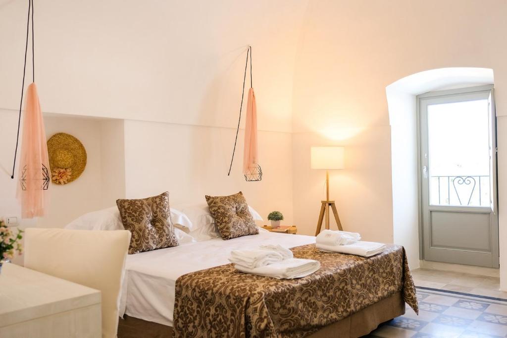 Postel nebo postele na pokoji v ubytování Masseria D'Erchia