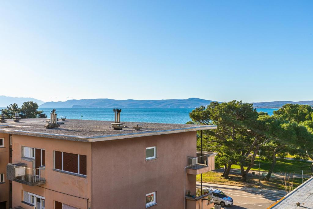 a view of the water from a building at Apartment Vivien in Crikvenica