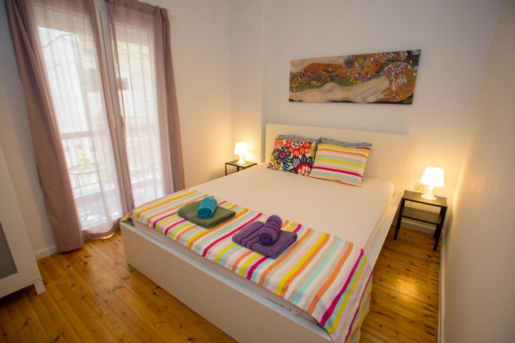 Postel nebo postele na pokoji v ubytování Central Studio Flat