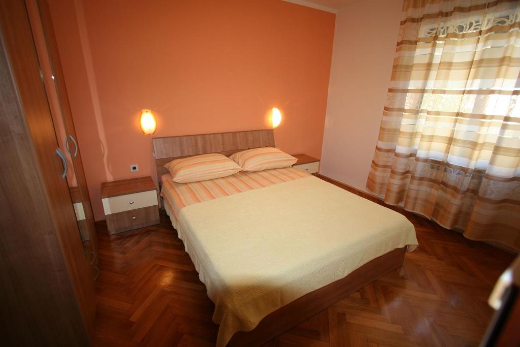 Postel nebo postele na pokoji v ubytování Apartments Grskovic G. Jesenovica