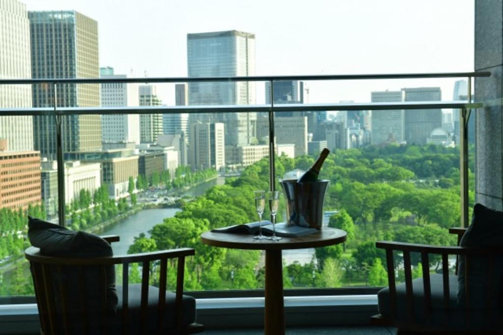 a view from a balcony overlooking a city at Palace Hotel Tokyo in Tokyo