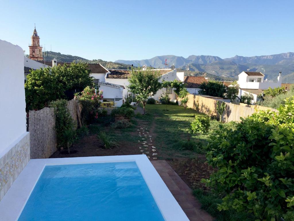 a view of a yard with a swimming pool at Casa Baraka in Algodonales