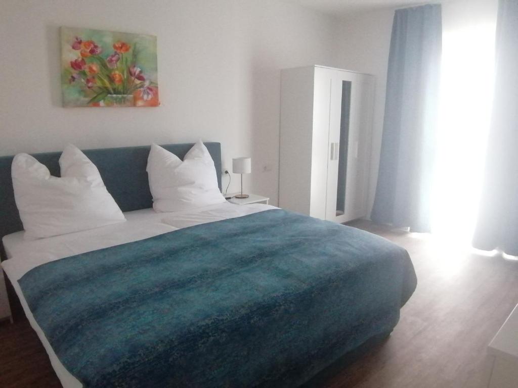 Postel nebo postele na pokoji v ubytování Catalleya Haus