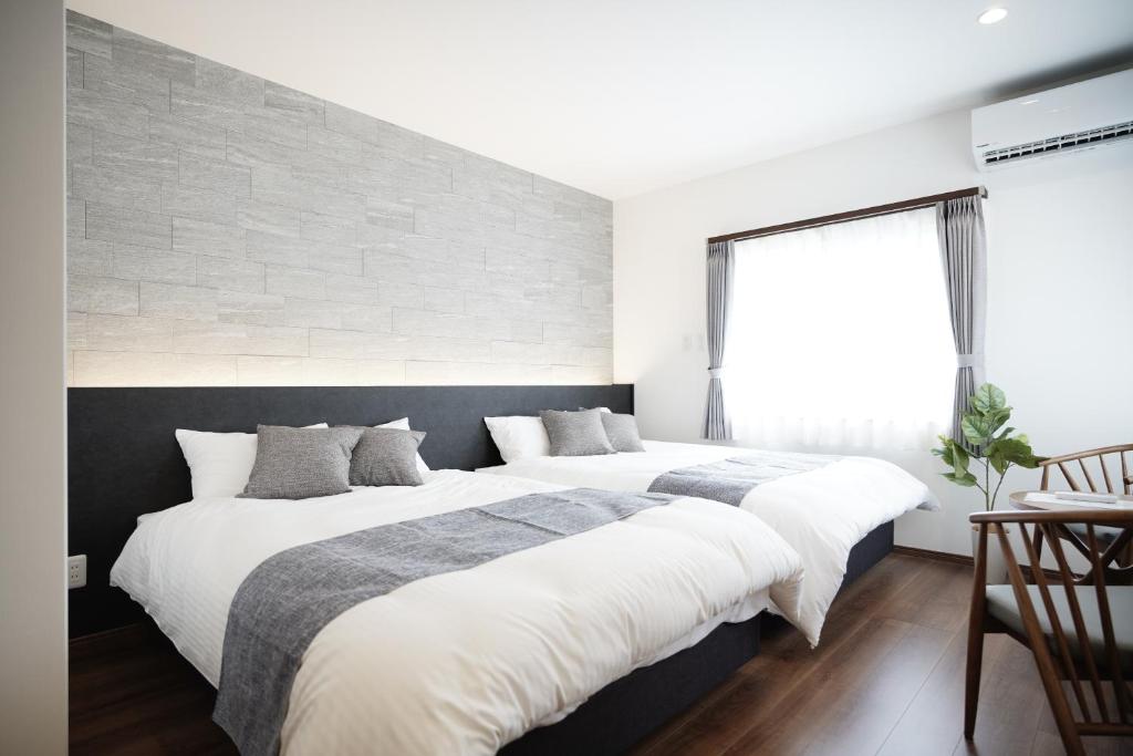 Postel nebo postele na pokoji v ubytování MP1 SENT RESORT VILLA Miyako-jima