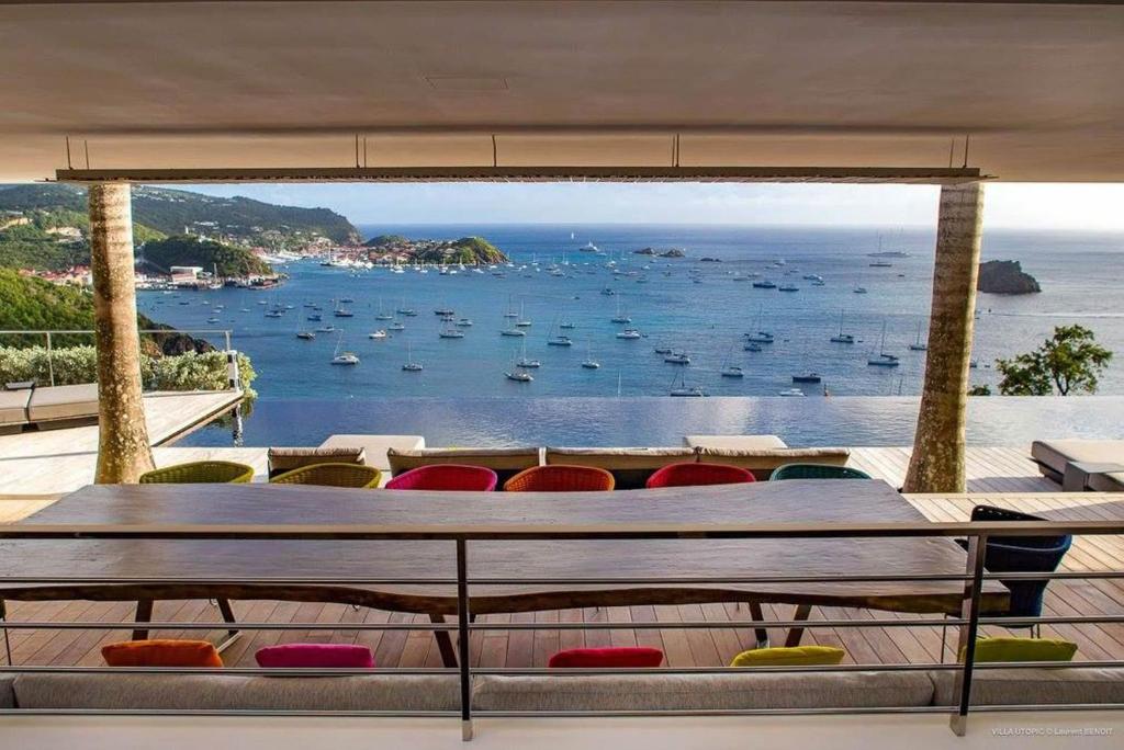 a view of the ocean from the balcony of a house at Dream Villa Corossol 643 in Gustavia