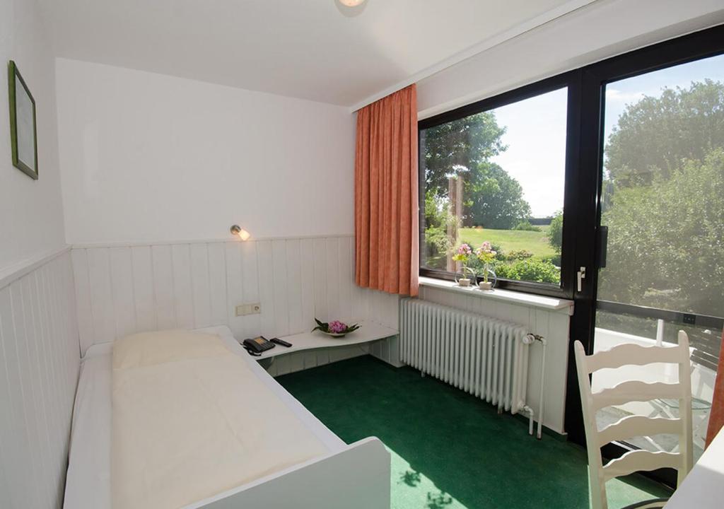 Postel nebo postele na pokoji v ubytování Hotel Lange