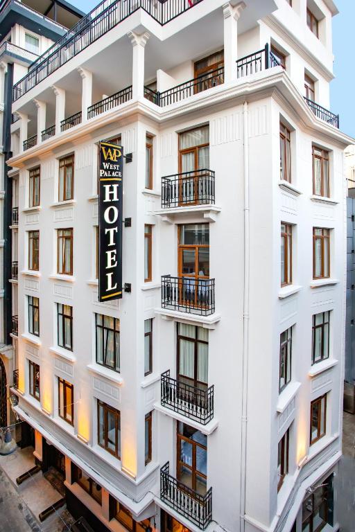 a white building with a sign on it at West Palace in Istanbul