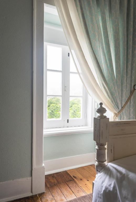 Postel nebo postele na pokoji v ubytování Quinta da Tapada