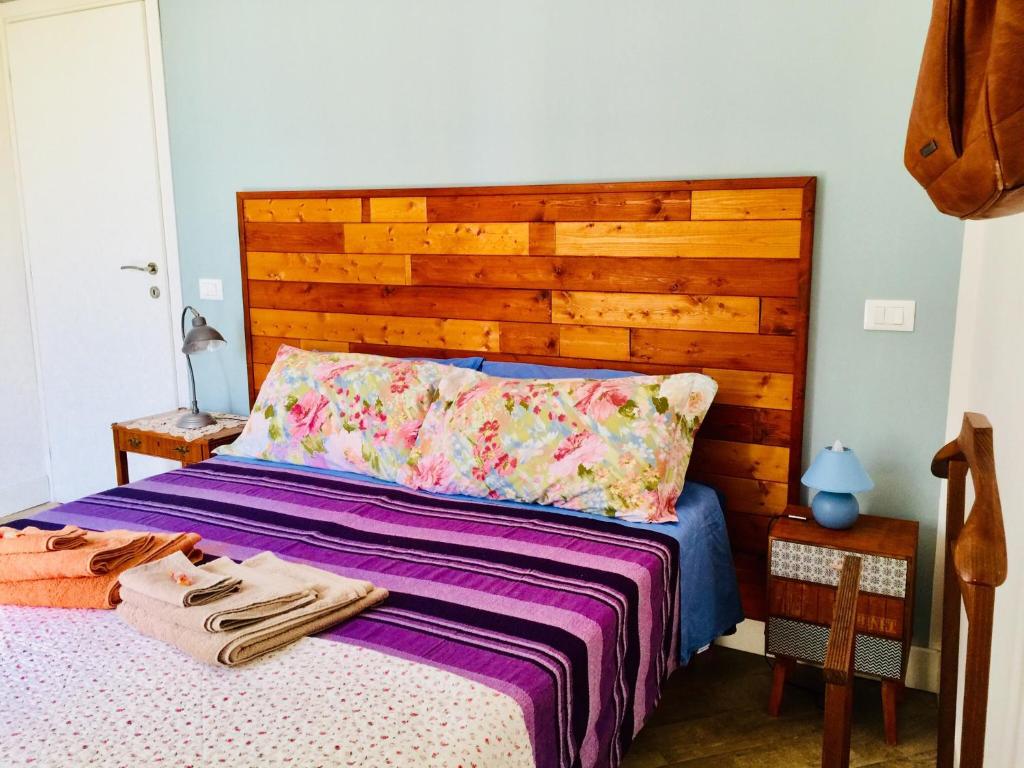 A bed or beds in a room at Gò Gò House 2 Casa Aprile