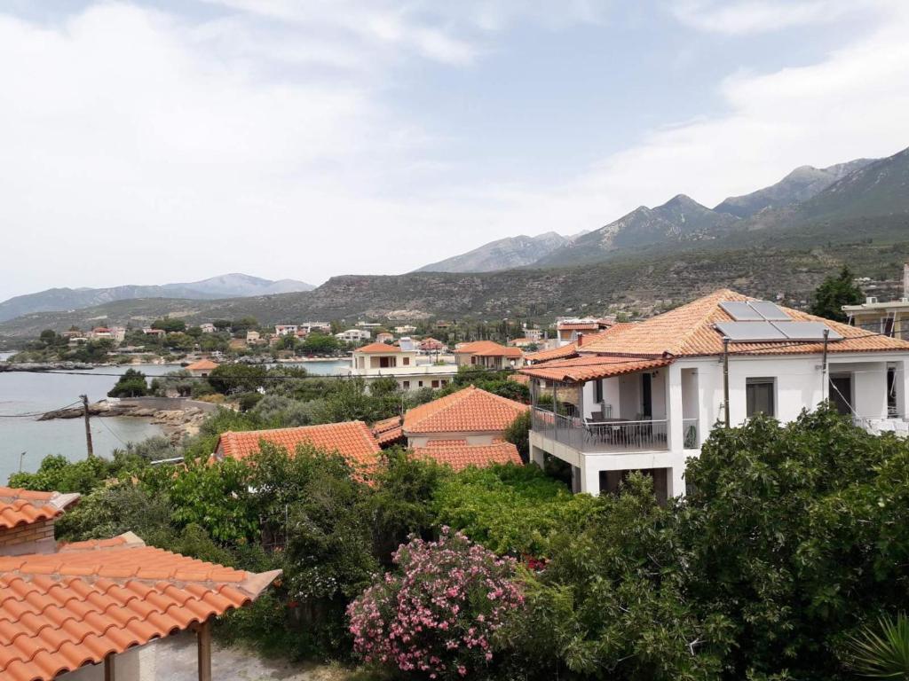 a view of a house with mountains in the background at Antonias house in Stoupa