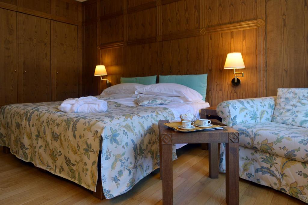 Postel nebo postele na pokoji v ubytování Savoia Palace Hotel