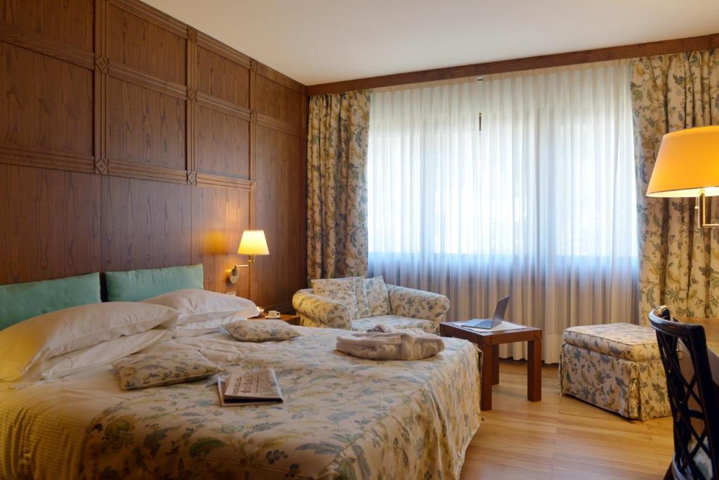 Postel nebo postele na pokoji v ubytování Savoia Palace Hotel