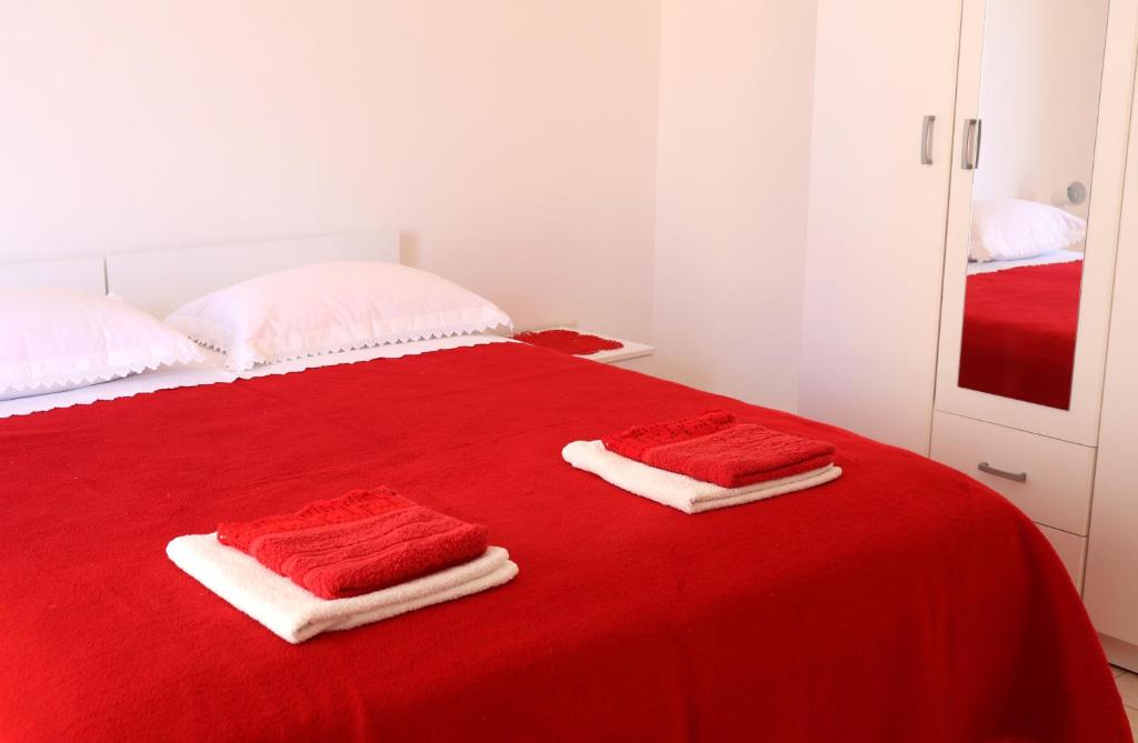 Postel nebo postele na pokoji v ubytování Apartments Frane