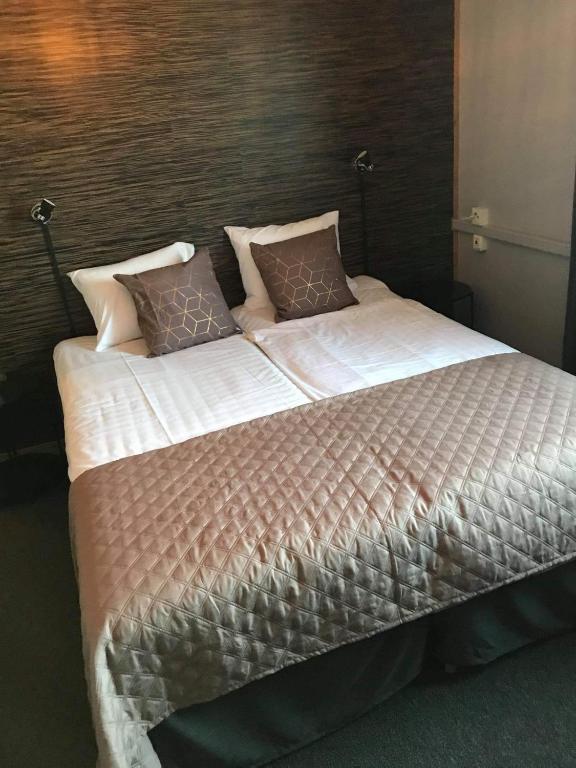 Postel nebo postele na pokoji v ubytování CarlstadCity H Boutique Hotell