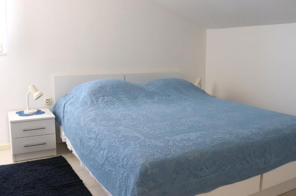 Postel nebo postele na pokoji v ubytování Apartments Frane